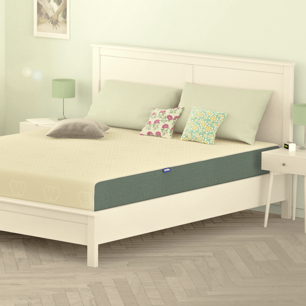 Sunday Ortho Latex 4 Mattress on a white bed frame in a bedroom