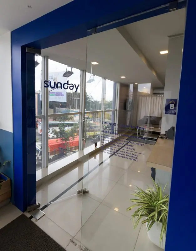 The glass doorway of the Bengaluru Sleep Lounge