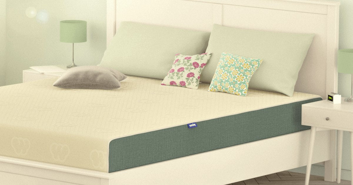 Sunday Ortho Latex 4 Mattress on a white bed frame in a bedroom