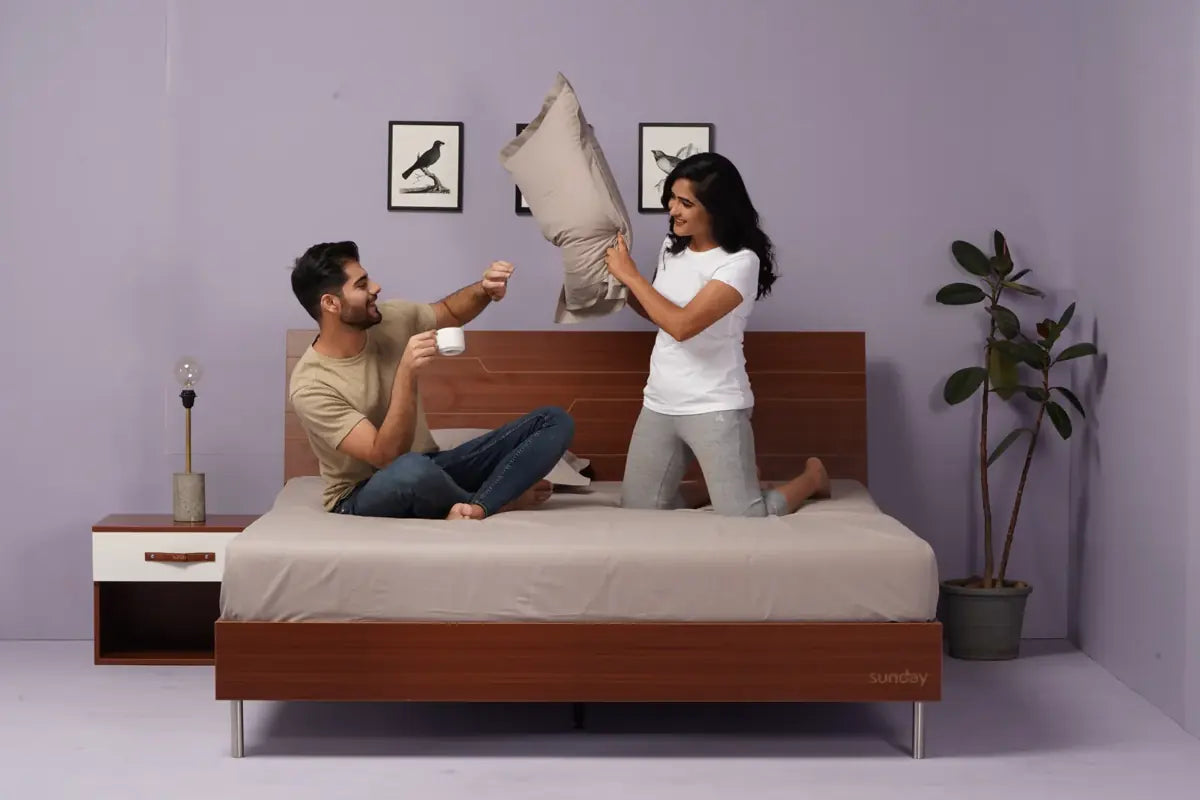 Two people on the Tilt Bed, having fun