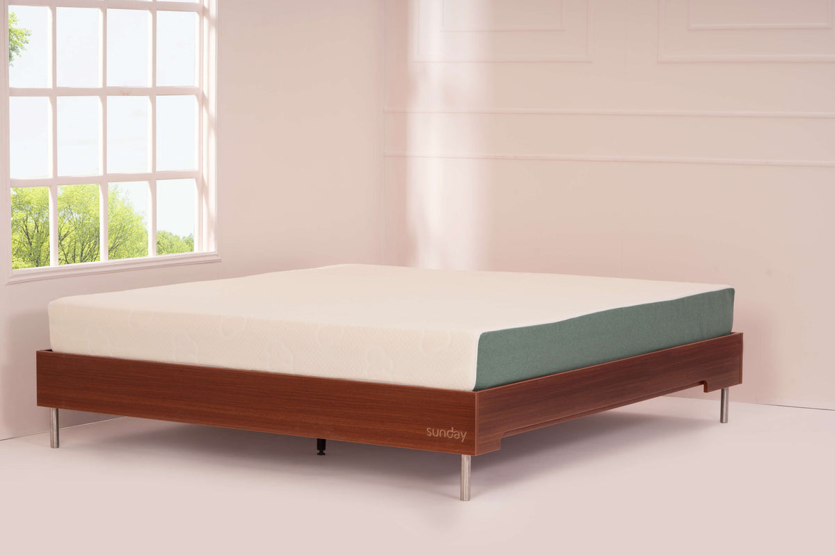 Sunday Tilt Bed frame with a mattress on it